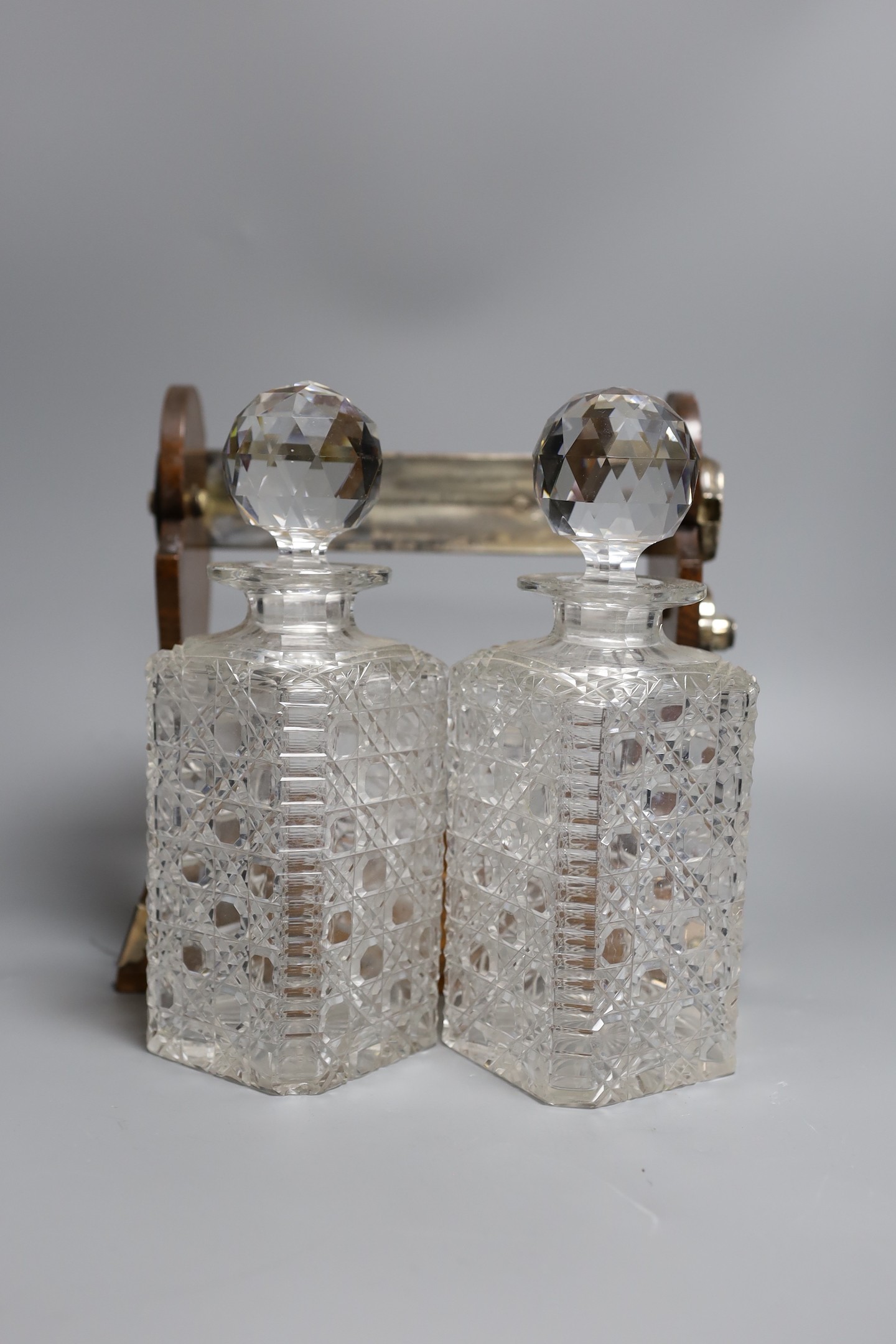 A Betjemann’s patent twin bottle oak and plated tantulus- no key, 32 cms high